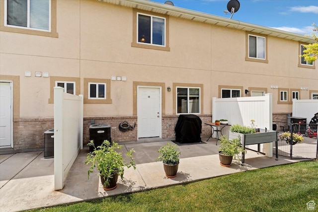 228 W 1975 N Unit 56, Harrisville, UT 84414 - back of house with a patio and stucco siding