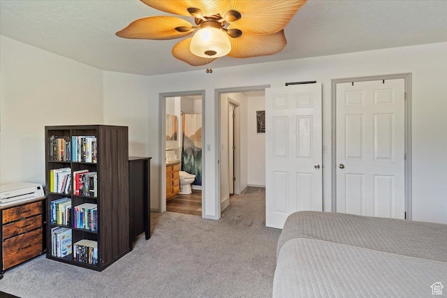 228 W 1975 N Unit 56, Harrisville, UT 84414 - bedroom featuring light colored carpet, ensuite bathroom, and ceiling fan