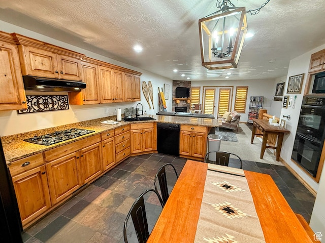 5060 E Lake View Dr N Unit 1108, Eden, UT 84310 - kitchen featuring black appliances, under cabinet range hood, a textured ceiling, open floor plan, and a peninsula