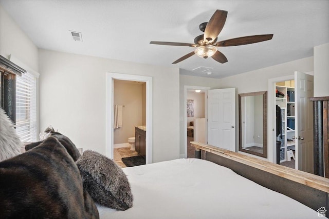 10848 S Tahoe Way S, Jordan, UT 84009 - bedroom with a spacious closet, connected bathroom, ceiling fan, and a closet