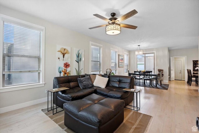 10848 S Tahoe Way S, Jordan, UT 84009 - living room featuring light wood finished floors and a ceiling fan