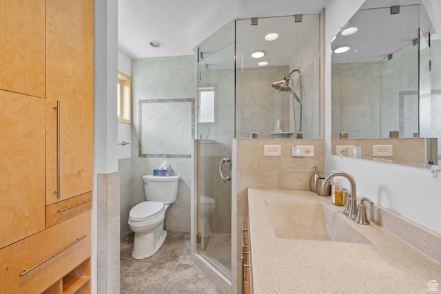 8711 S Rustler Rd, Cottonwood Heights, UT 84093 - bathroom featuring a shower stall, vanity, and tile walls
