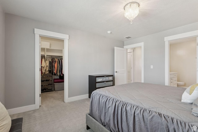 910 W 800 N, Tremonton, UT 84337 - bedroom with a walk in closet, light carpet, a closet, and connected bathroom