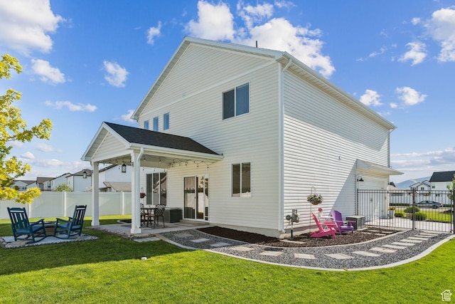 910 W 800 N, Tremonton, UT 84337 - back of house with a fenced backyard, a patio area, and a garage