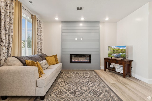 910 W 800 N, Tremonton, UT 84337 - living room featuring wood finished floors, a large fireplace, and recessed lighting