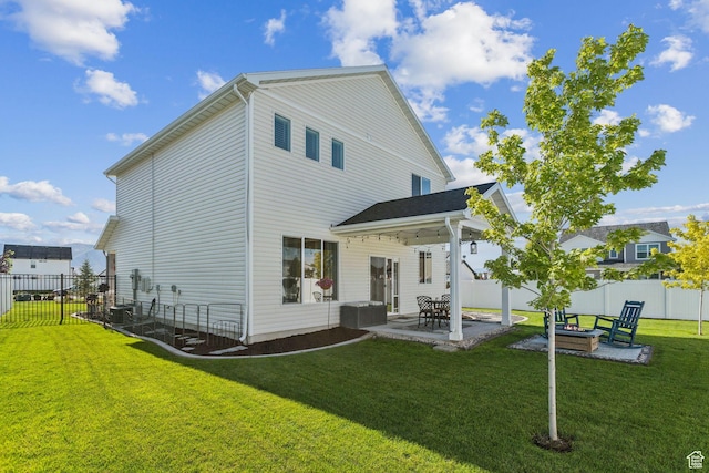 910 W 800 N, Tremonton, UT 84337 - rear view of house with a patio, a fenced backyard, and an outdoor fire pit