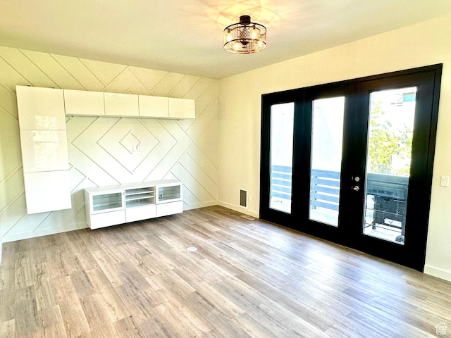 4843 W S Jordan Pkwy S, South Jordan, UT 84009 - foyer entrance with light wood-style flooring and french doors