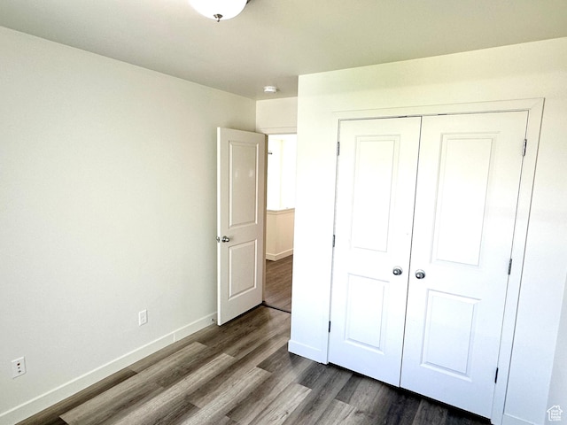 4843 W S Jordan Pkwy S, South Jordan, UT 84009 - unfurnished bedroom with dark wood-style flooring and a closet