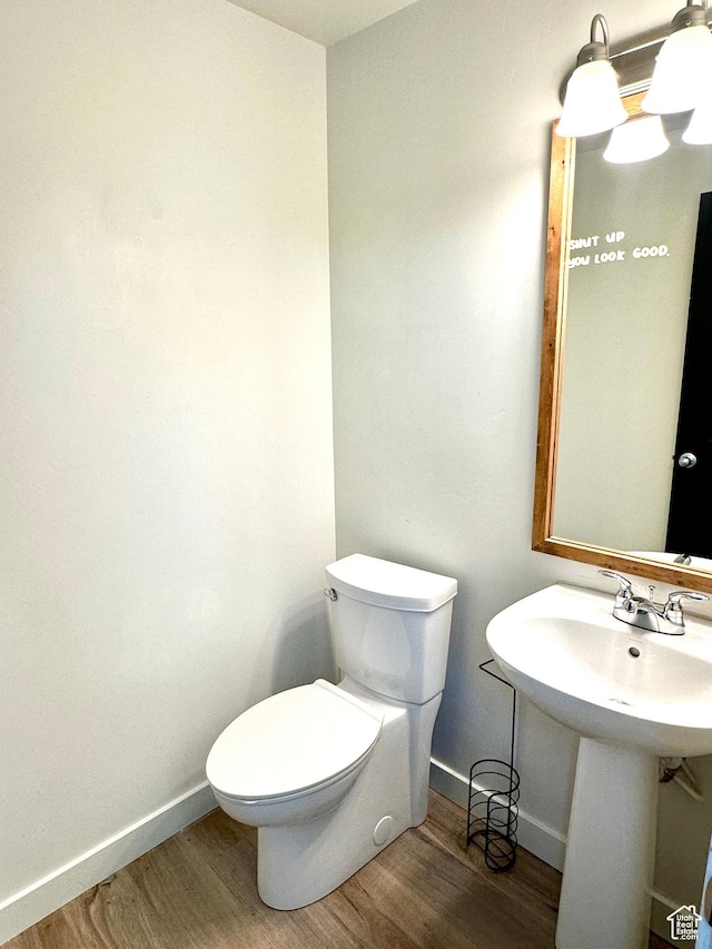 4843 W S Jordan Pkwy S, South Jordan, UT 84009 - half bathroom with wood finished floors and toilet