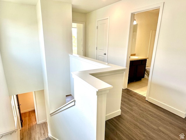 4843 W S Jordan Pkwy S, South Jordan, UT 84009 - hall with an upstairs landing and wood finished floors