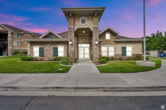 1225 W Dallin Dr Unit Q102, Pleasant Grove, UT 84062 - view of front of property with stucco siding, stone siding, french doors, and a front yard