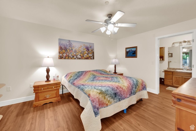 1225 W Dallin Dr Unit Q102, Pleasant Grove, UT 84062 - bedroom with light wood-style flooring, ensuite bath, and a ceiling fan