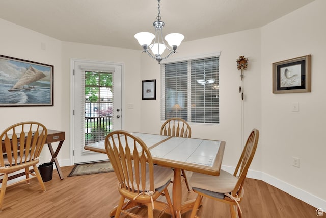 1225 W Dallin Dr Unit Q102, Pleasant Grove, UT 84062 - dining space featuring a chandelier and light wood-style flooring