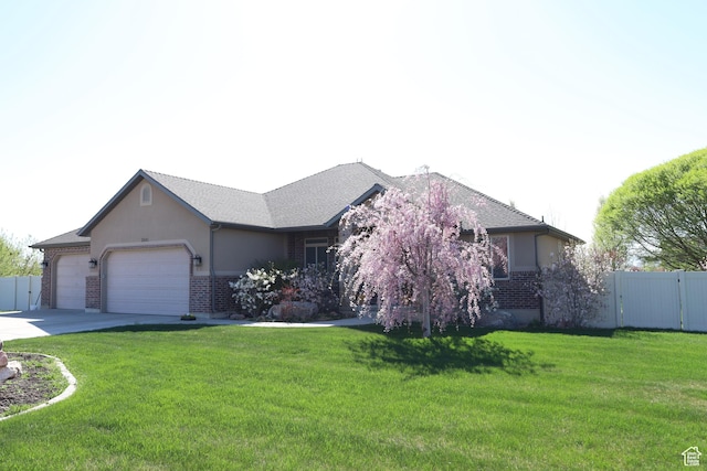 2681 N 3375 W, Plain City, UT 84404 - ranch-style house featuring brick siding, a garage, and driveway