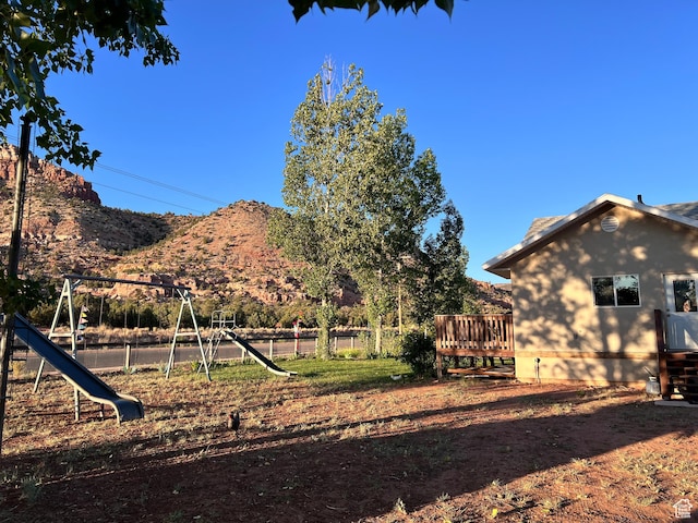 785 N Homestead St, Hildale, UT 84784 - view of yard featuring a playground and a deck with mountain view