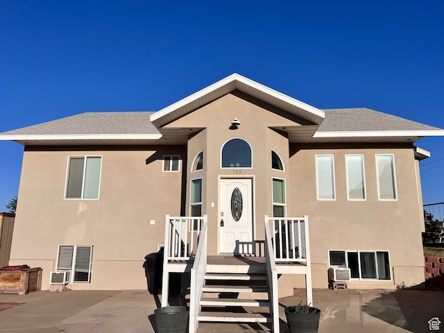 785 N Homestead St, Hildale, UT 84784 - view of front of property with stucco siding, a patio area, and a shingled roof