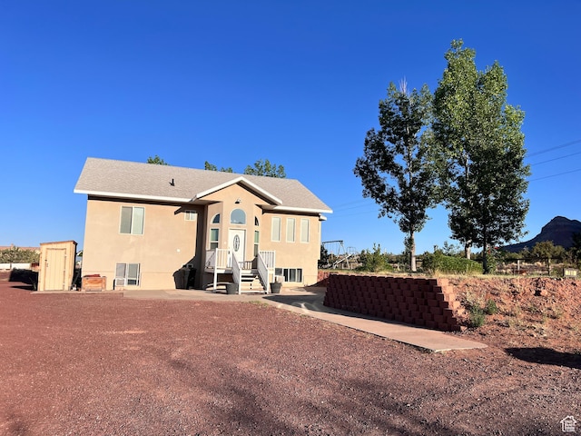 785 N Homestead St, Hildale, UT 84784 - rear view of house with stucco siding
