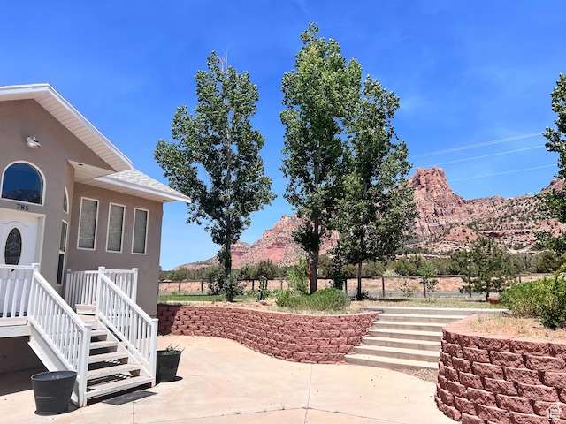 785 N Homestead St, Hildale, UT 84784 - view of patio / terrace featuring a mountain view and stairs