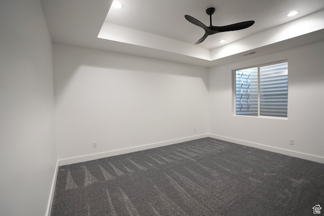 9281 E Rdg Pine Dr, Heber City, UT 84032 - spare room featuring a ceiling fan, dark carpet, a raised ceiling, and recessed lighting