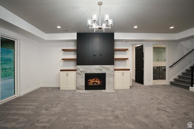 9281 E Rdg Pine Dr, Heber City, UT 84032 - unfurnished living room featuring washer and clothes dryer, carpet flooring, recessed lighting, stairs, and a chandelier