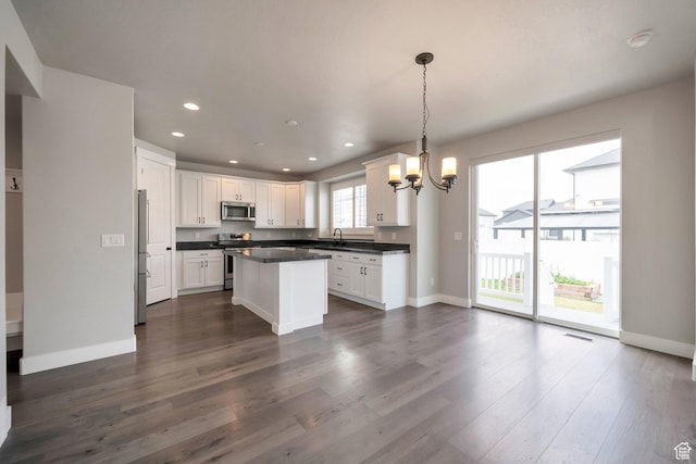 3552 W 2950 N, Lehi, UT 84043 - kitchen featuring stainless steel appliances, a chandelier, dark countertops, recessed lighting, and white cabinetry