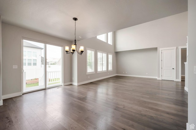3552 W 2950 N, Lehi, UT 84043 - empty room featuring a chandelier, dark wood finished floors, and a towering ceiling
