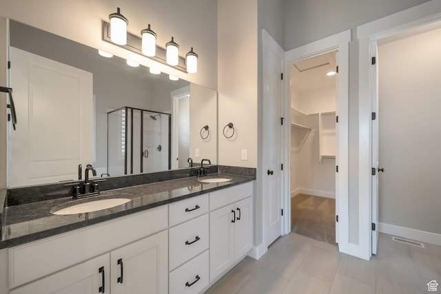 3552 W 2950 N, Lehi, UT 84043 - full bath with a spacious closet, a stall shower, double vanity, and tile patterned floors