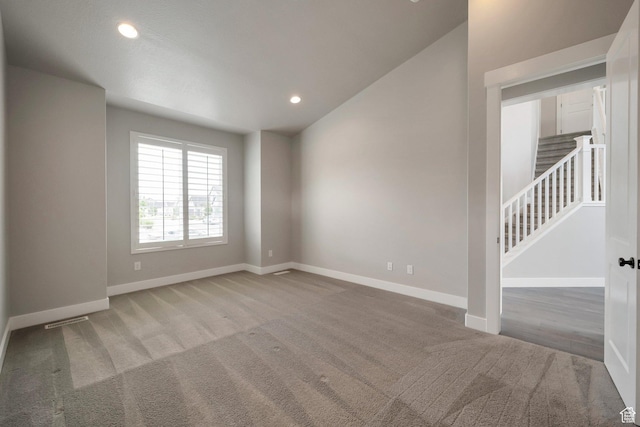 3552 W 2950 N, Lehi, UT 84043 - spare room featuring carpet floors, recessed lighting, vaulted ceiling, and stairway