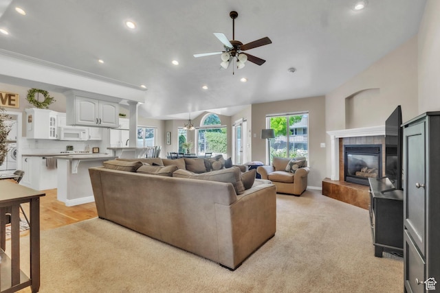 1630 N Camelot Dr E, North Logan, UT 84341 - living room featuring plenty of natural light, recessed lighting, ceiling fan, a fireplace, and light carpet