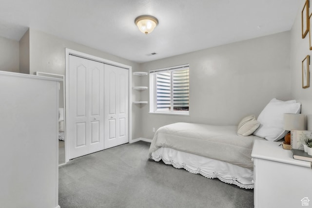 1630 N Camelot Dr E, North Logan, UT 84341 - carpeted bedroom featuring a closet and baseboards