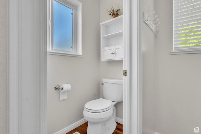 1630 N Camelot Dr E, North Logan, UT 84341 - bathroom featuring baseboards and wood finished floors