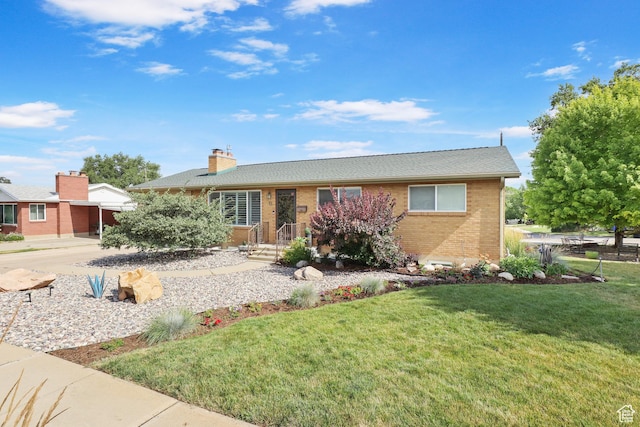 61 E 1700 S, Bountiful, UT 84010 - ranch-style home with brick siding, a front yard, concrete driveway, and a chimney