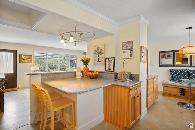 61 E 1700 S, Bountiful, UT 84010 - kitchen with a breakfast bar area, stone countertops, ornamental molding, brown cabinets, and pendant lighting