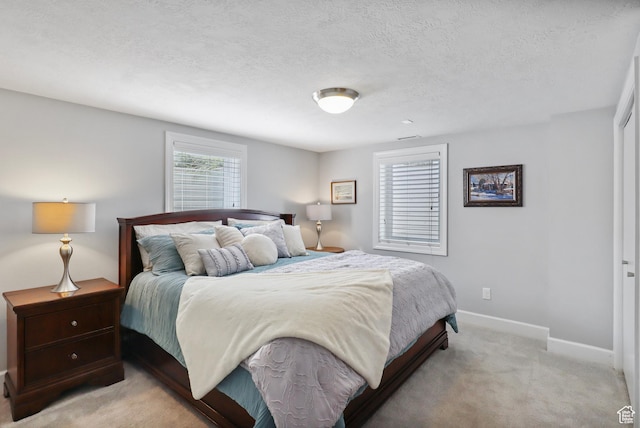 61 E 1700 S, Bountiful, UT 84010 - bedroom featuring light carpet and a textured ceiling