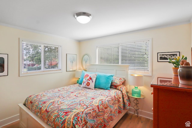 61 E 1700 S, Bountiful, UT 84010 - bedroom with multiple windows, wood finished floors, and ornamental molding
