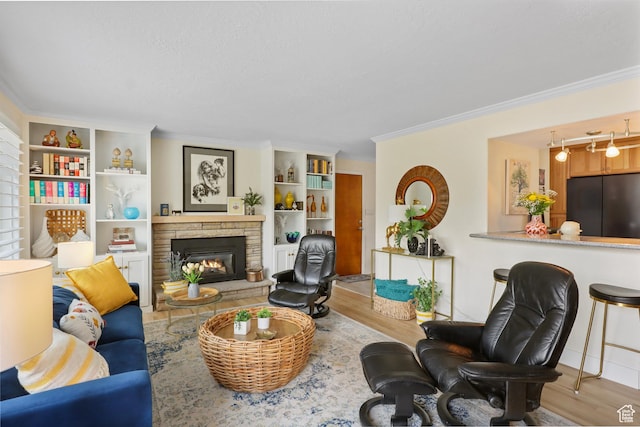 61 E 1700 S, Bountiful, UT 84010 - living room with ornamental molding, wood finished floors, a stone fireplace, and built in shelves