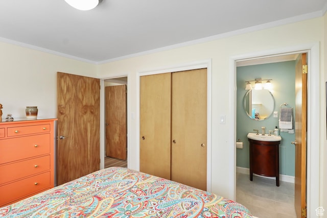 61 E 1700 S, Bountiful, UT 84010 - bedroom featuring a closet, crown molding, and ensuite bathroom