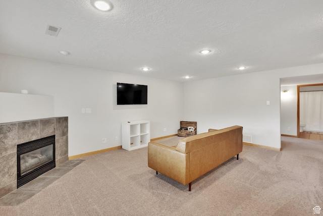 1719 Clyde Lake Dr Unit 346, Heber City, UT 84032 - living room with light colored carpet, a tile fireplace, a textured ceiling, and recessed lighting