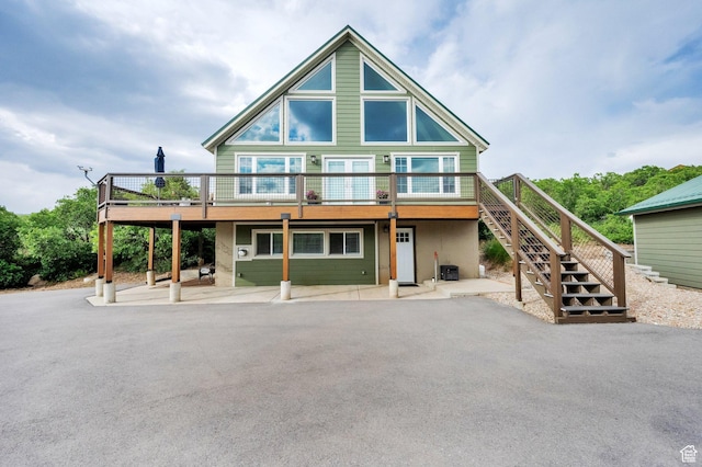 1719 Clyde Lake Dr Unit 346, Heber City, UT 84032 - view of front of property with stairs, a wooden deck, and a patio
