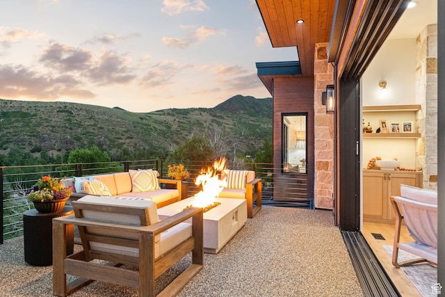 1400 Weber Wild Rd, Oakley, UT 84055 - patio / terrace featuring a mountain view and an outdoor living space with a fire pit