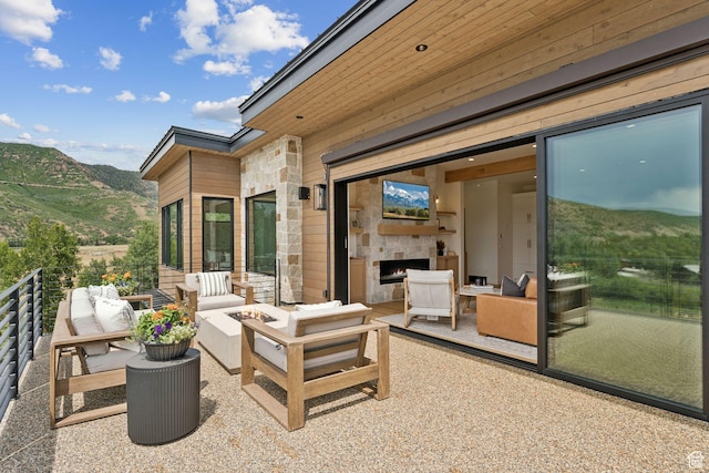 1400 Weber Wild Rd, Oakley, UT 84055 - view of patio featuring an outdoor living space and a mountain view