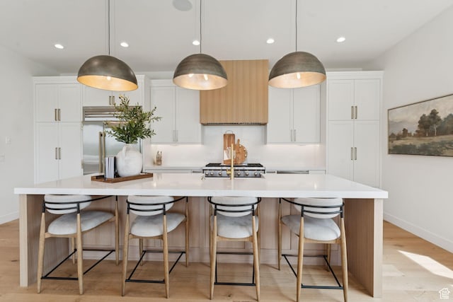 1400 Weber Wild Rd, Oakley, UT 84055 - kitchen featuring stainless steel built in refrigerator, light wood-type flooring, a large island, light countertops, and recessed lighting