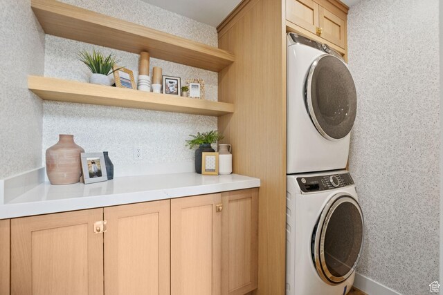 1400 Weber Wild Rd, Oakley, UT 84055 - laundry area with stacked washer / drying machine and cabinet space