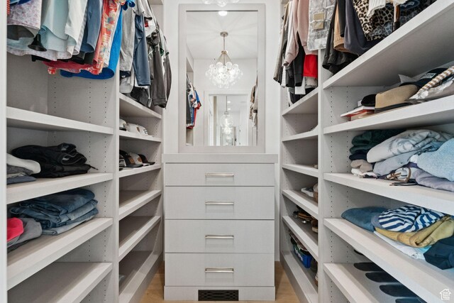 1400 Weber Wild Rd, Oakley, UT 84055 - walk in closet featuring a chandelier and light wood-type flooring