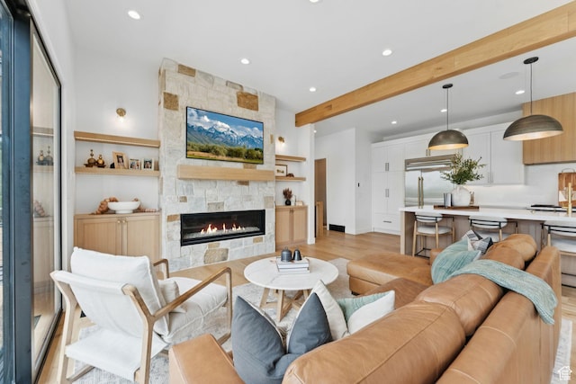 1400 Weber Wild Rd, Oakley, UT 84055 - living room with beamed ceiling, light wood finished floors, recessed lighting, and a tile fireplace