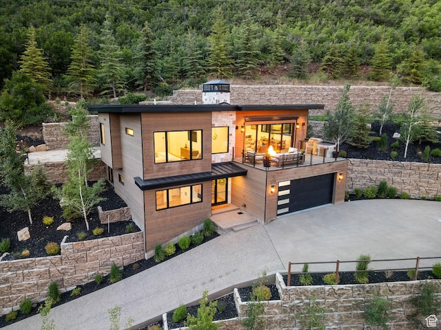 1400 Weber Wild Rd, Oakley, UT 84055 - contemporary house with a forest view, driveway, and a garage
