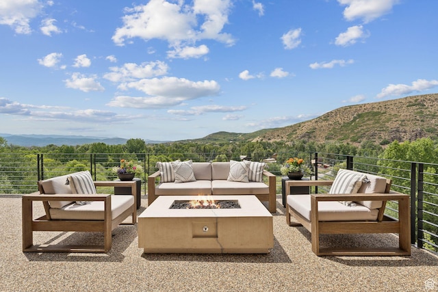 1400 Weber Wild Rd, Oakley, UT 84055 - view of patio with a mountain view and an outdoor living space with a fire pit