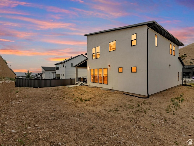 5796 N Valley View Rd, Lehi, UT 84043 - rear view of house with stucco siding and a garage