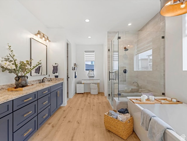 5796 N Valley View Rd, Lehi, UT 84043 - bathroom with vanity, a shower stall, a freestanding tub, healthy amount of natural light, and recessed lighting