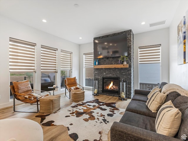 5796 N Valley View Rd, Lehi, UT 84043 - living area featuring wood finished floors, a large fireplace, and recessed lighting